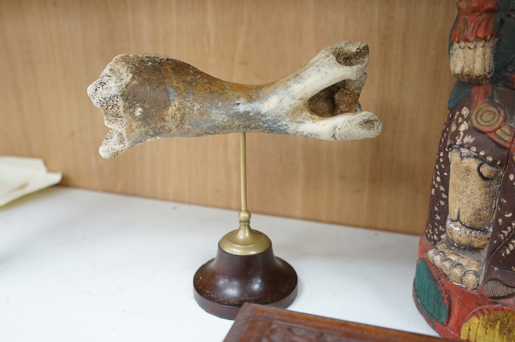 Eight south-east Asian carvings and a mounted bone, tallest 43cm